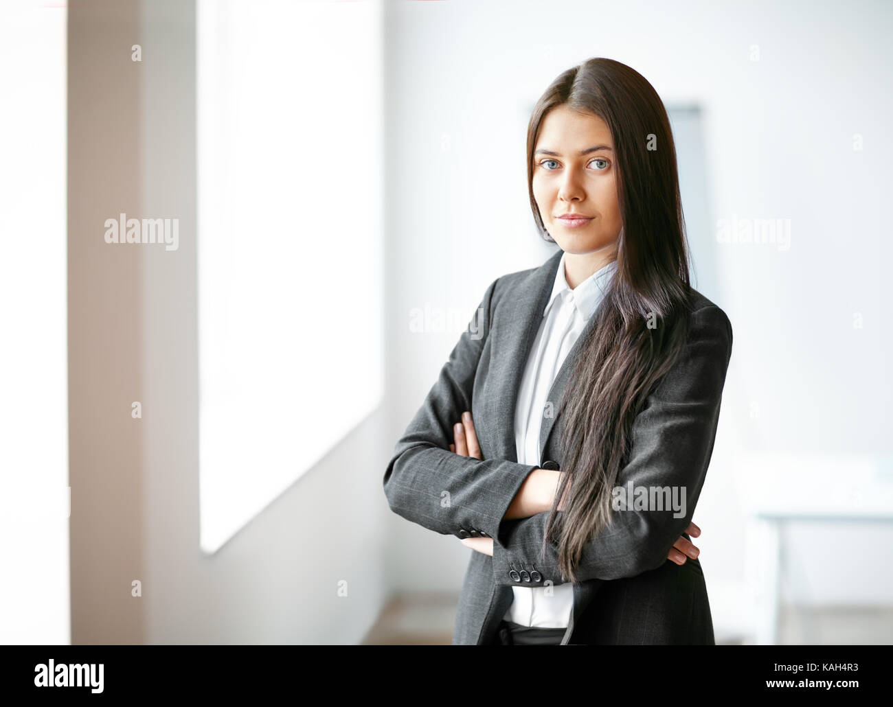 Portrait of young beautiful business woman in the office Stock Photo ...