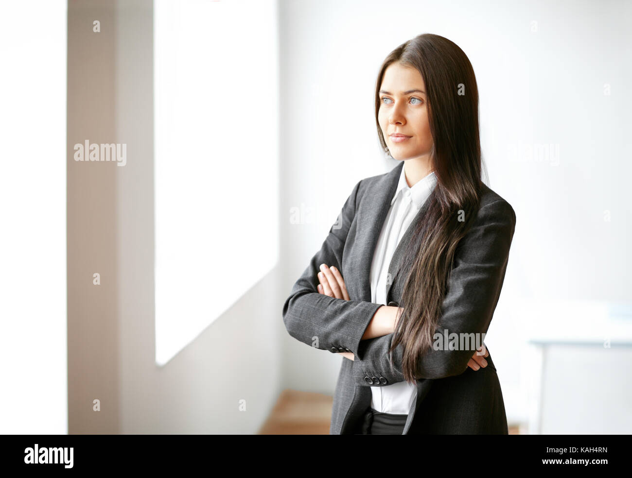 Portrait of young beautiful business woman in the office Stock Photo ...