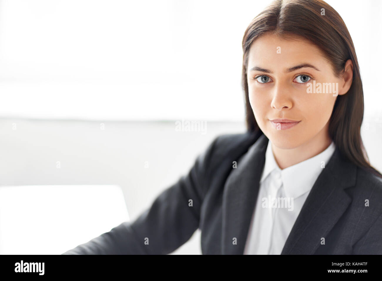 Portrait of young beautiful business woman in the office Stock Photo ...