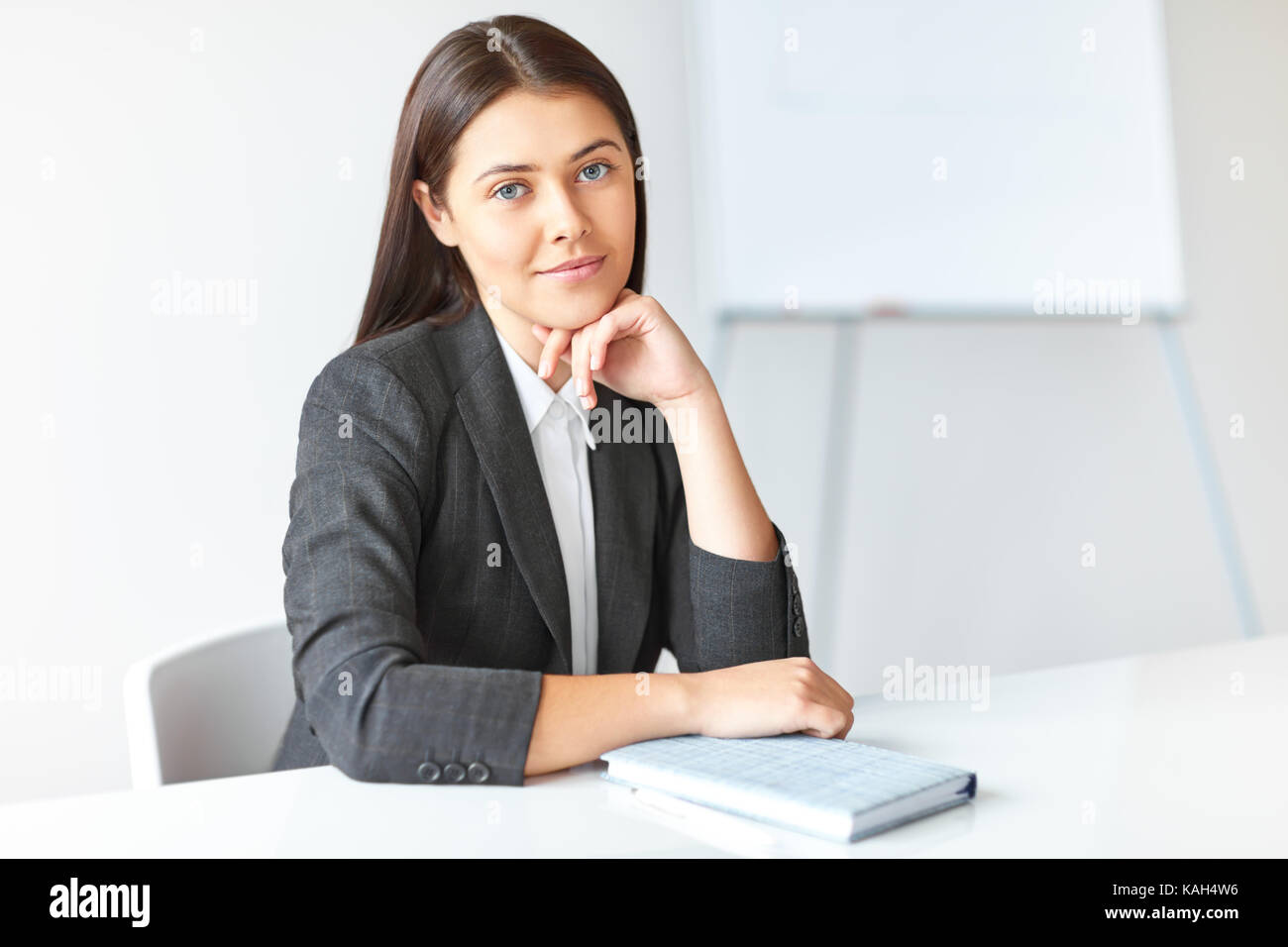 Portrait of young beautiful business woman in the office Stock Photo ...
