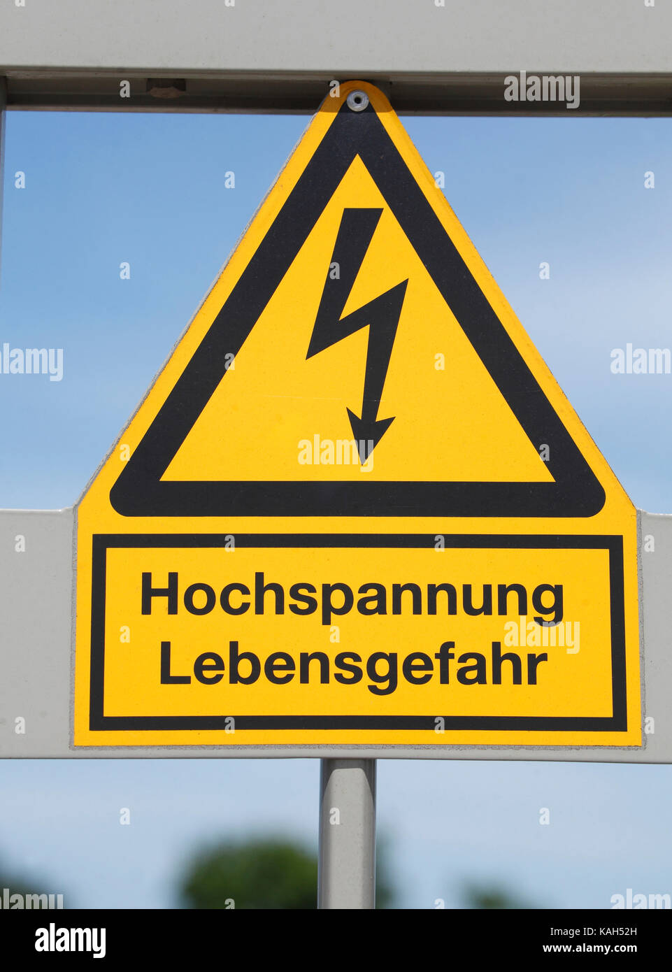 Danger sign in German, high voltage, danger ( Hochspannung , Lebensgefahr in German) Stock Photo