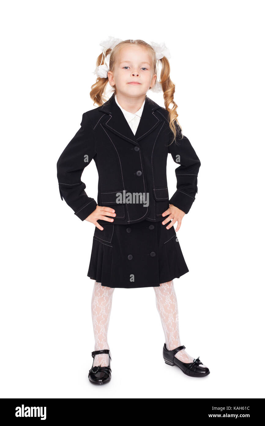 nice little girl with bows in a school uniform isolated on white ...
