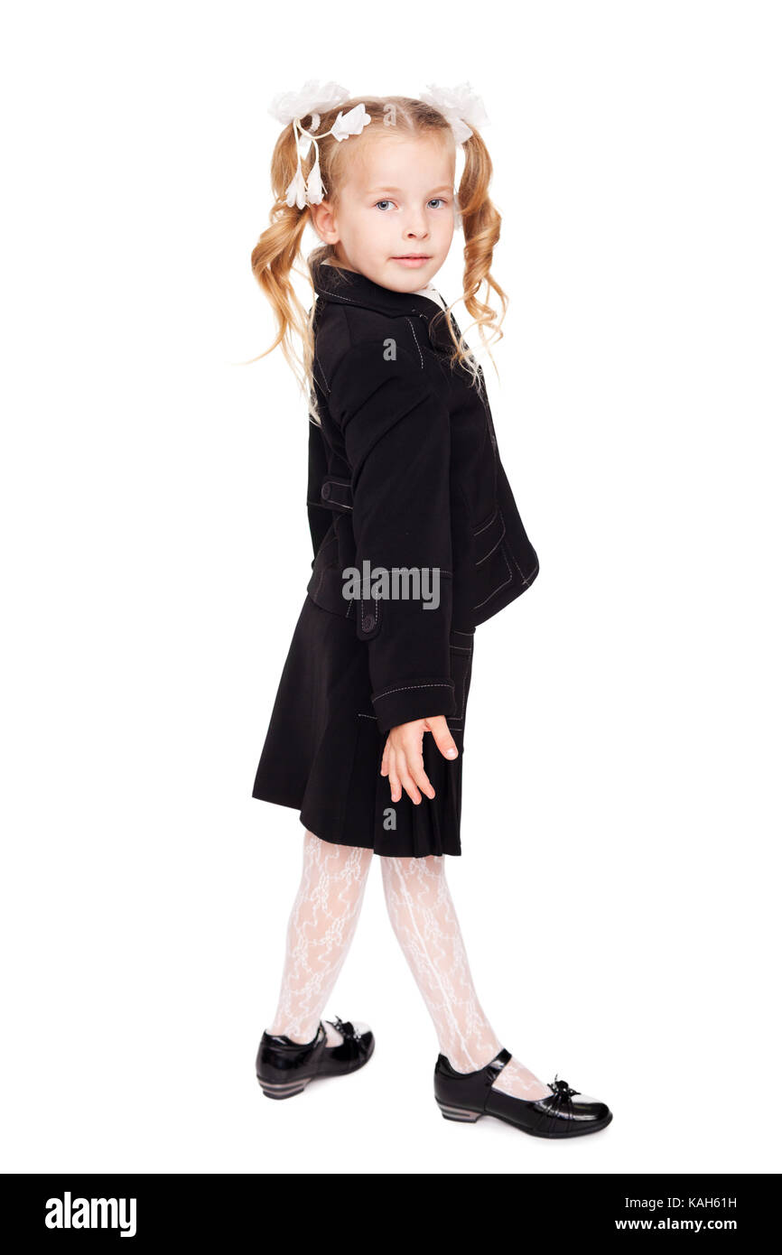 nice little girl with bows in a school uniform isolated on white ...