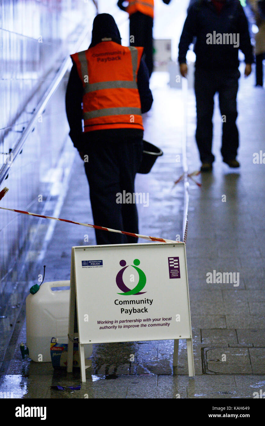 Offenders cleaning the tunnel walls of Hyde Park Corner tube as part of