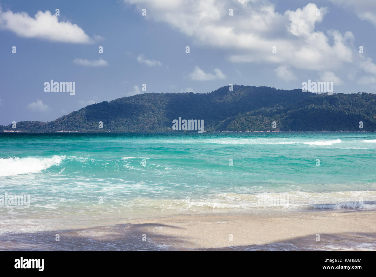 Untouched tropical beach and sea on a sunny summer day. Perhentian island, Malaysia. Stock Photo