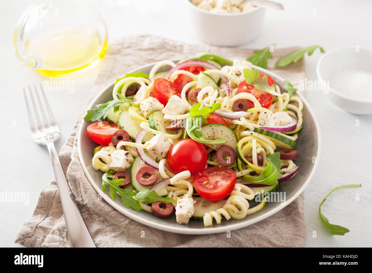 spiralized courgette salad greek style with tomato feta olives cucumber Stock Photo