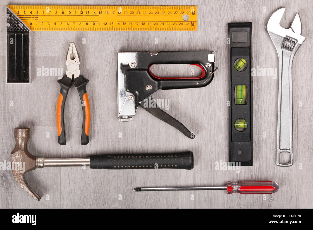 Tool kit on grey wooden desk Stock Photo Alamy