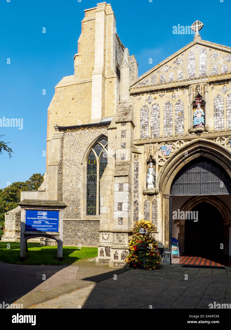 The ornate decorated porch of St Nicholas Church in the market town of