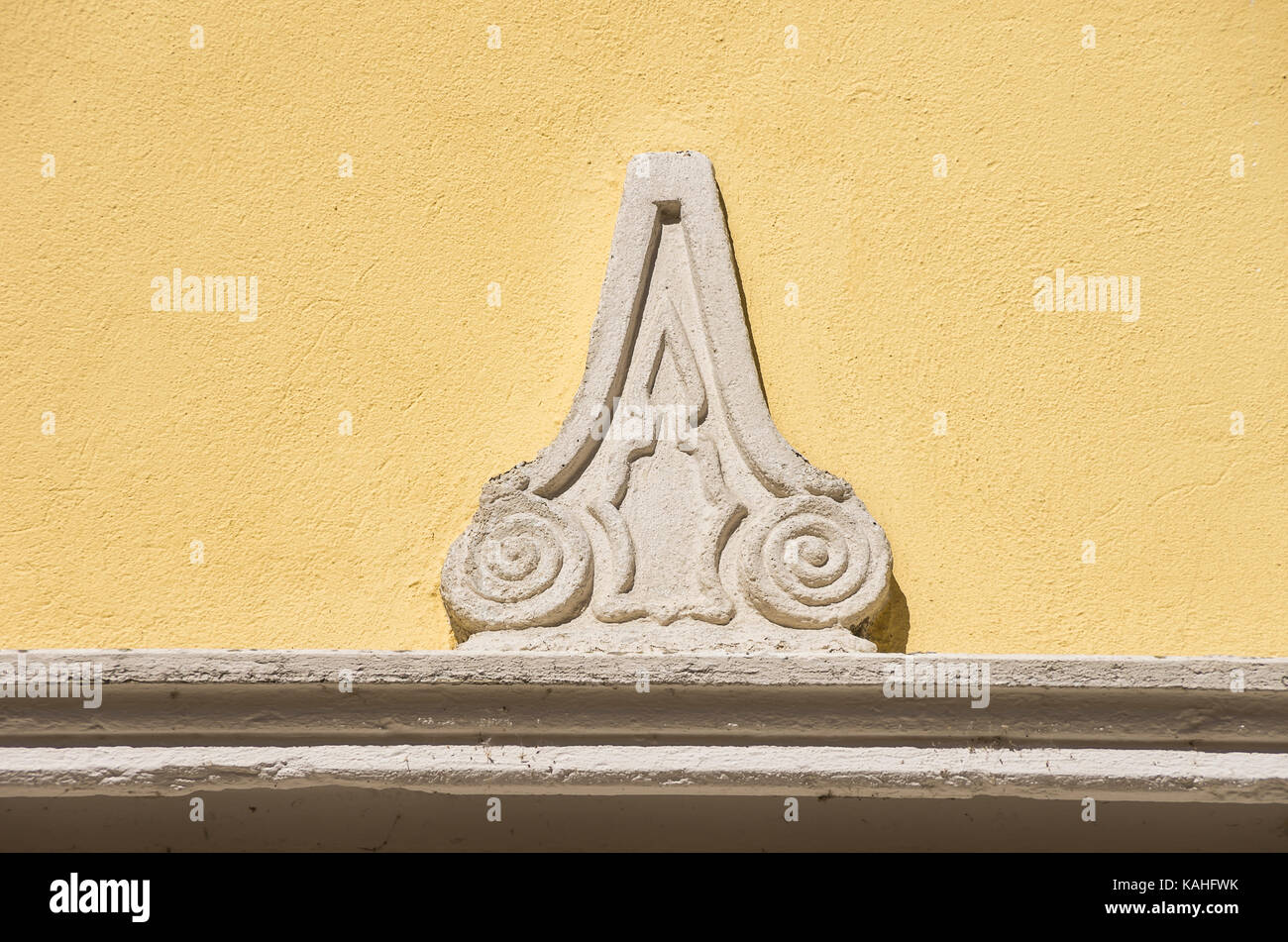Historic facade ornament in the form of a candle, Pirna, Saxony, Germany. Stock Photo