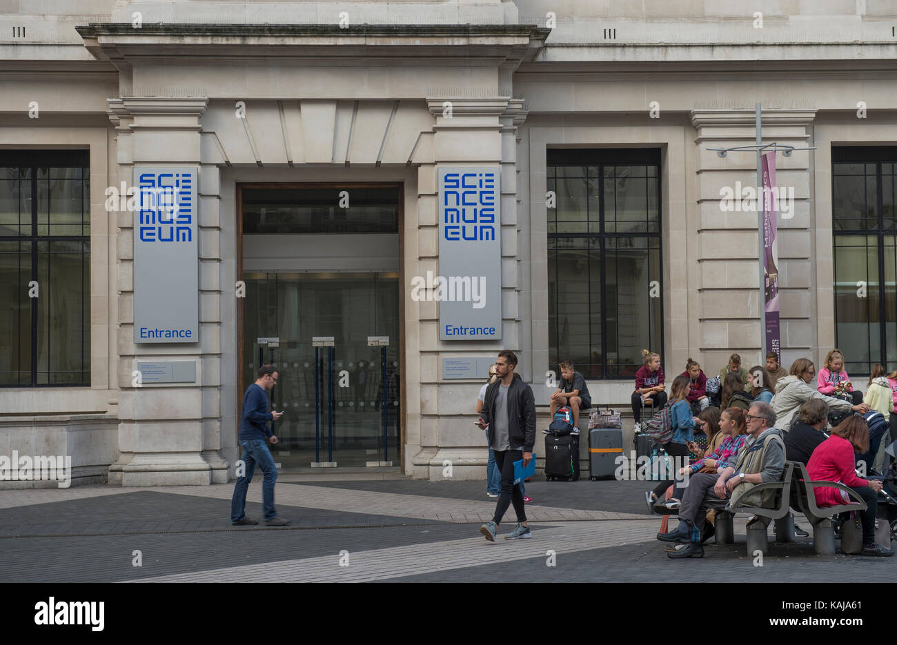 Early morning visitors wait for the Science Museum to open, Exhibition Road, London, UK Stock Photo