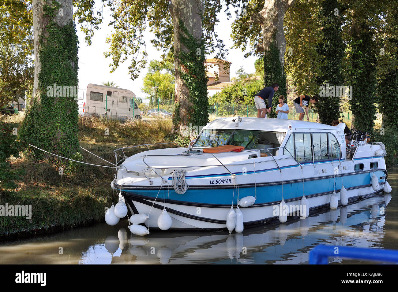 Pleasure boat sailing on the Canal du Midi near Beziers for a tourist cruise Stock Photo