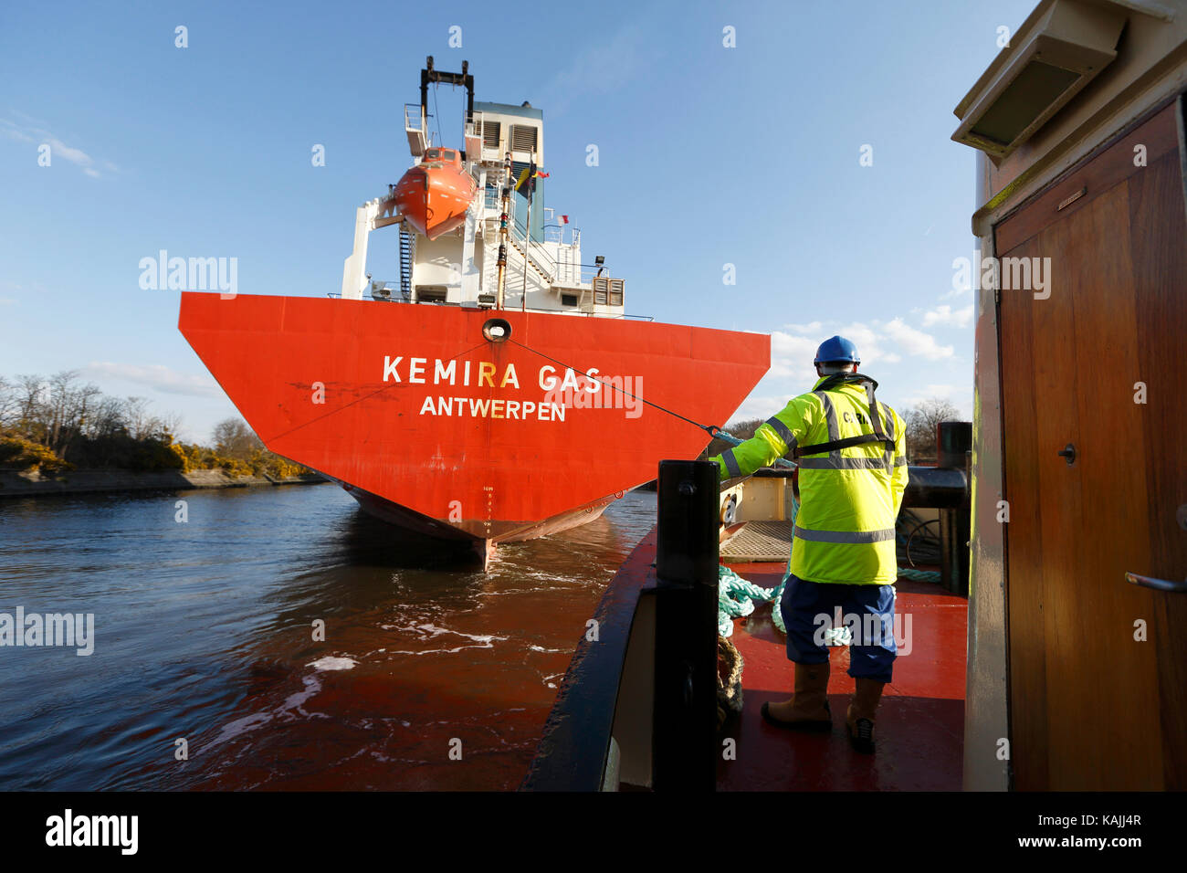 Tug boat MSC Viking pulls Kemira Gas on the Manchester Ship Canal by the River Mersey in the NE of England on April 2, 2013. Stock Photo