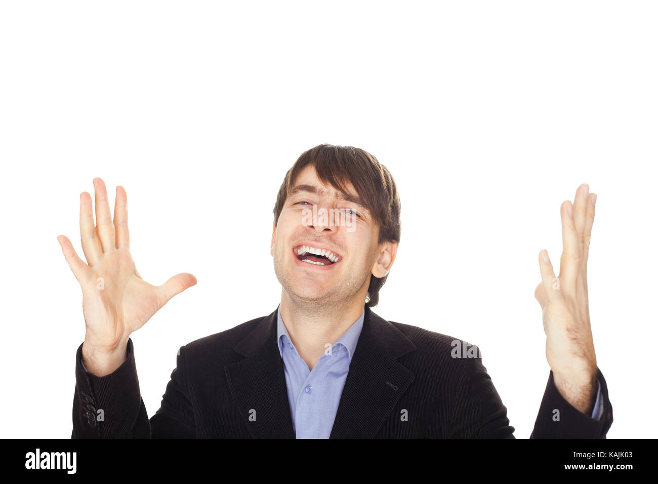Excited young business man with arms raised in success isolated on ...