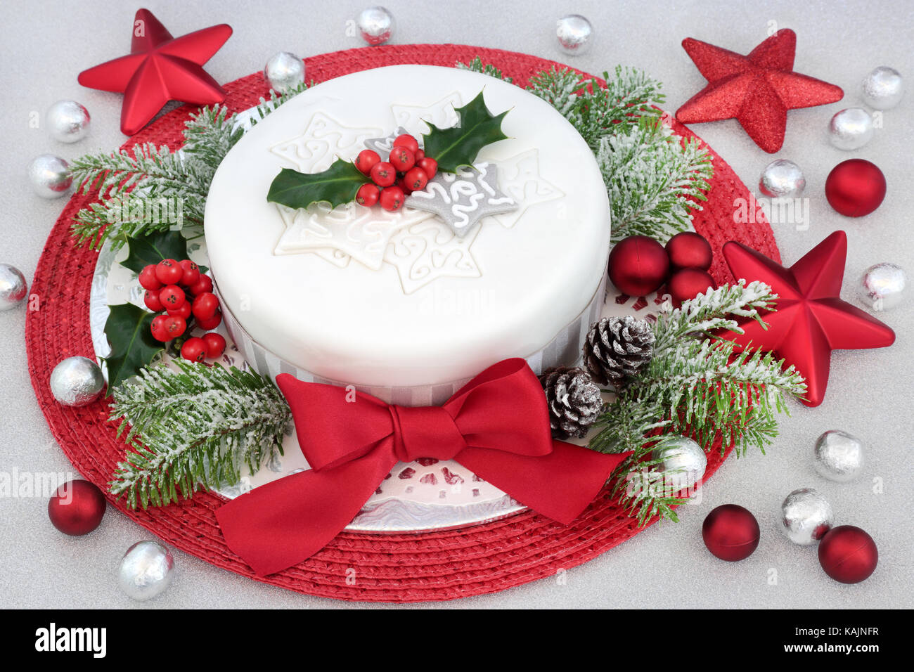 Traditional Christmas Cake With Icing And Red Bow With Holly