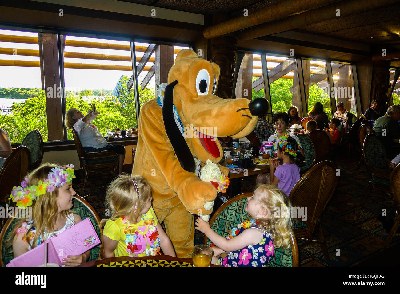 Children meeting Pluto in Disney World Florida Stock Photo