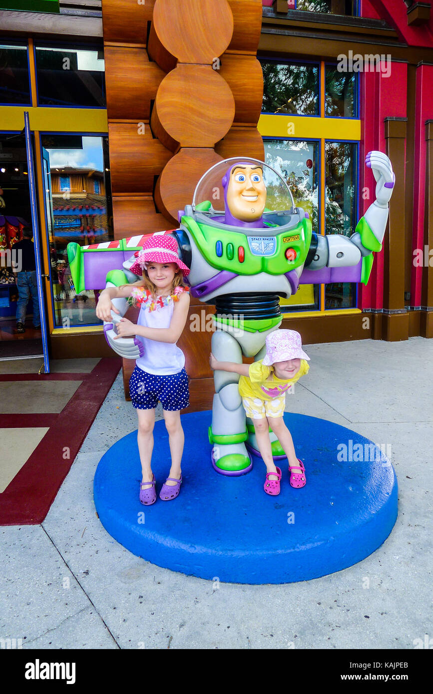 Children hugging buzz lightyear in downtown disney marketplace, Orlando Florida, USA Stock Photo