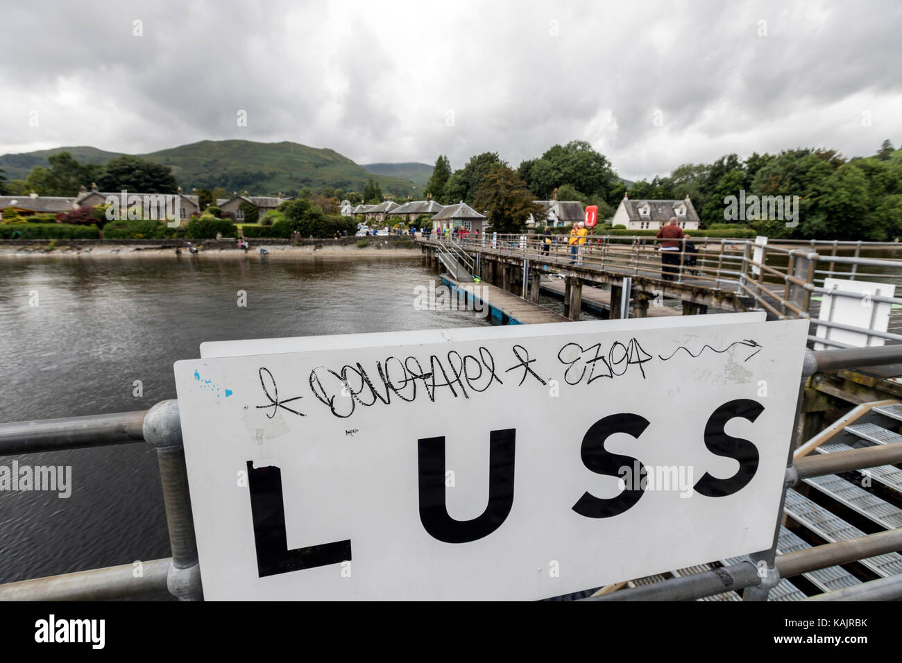 Tourist in the Luss Pier, on the west bank of Loch Lomond., Argyll