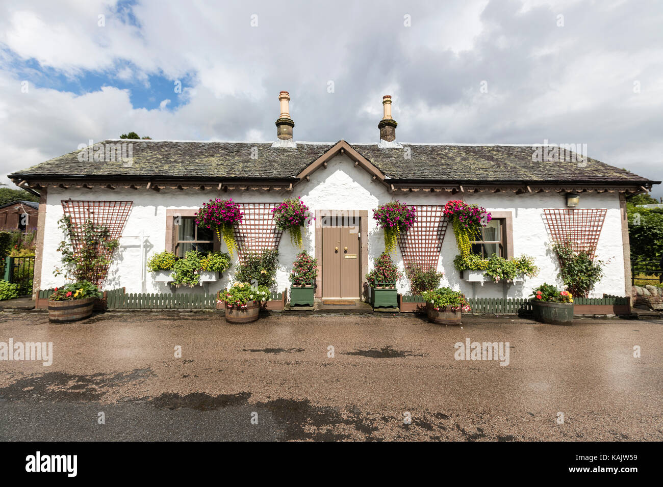 Typical houses in Luss with plenty of flowers, on the west bank of Loch