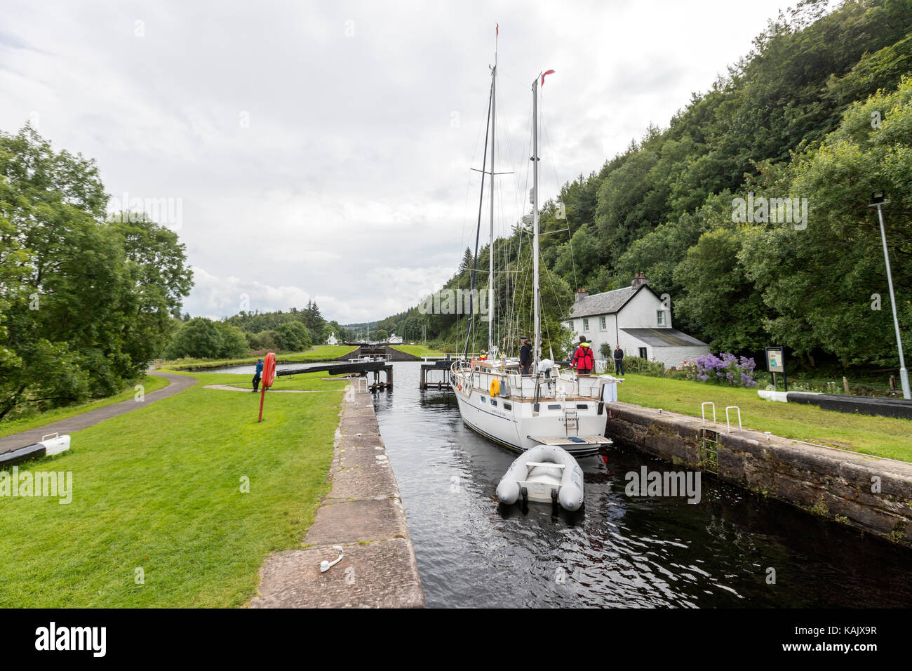 Opening the locks to allow a boat crossing a lock in Dunardry locks, Crinan Canal, Argyll and Bute Scotland Stock Photo