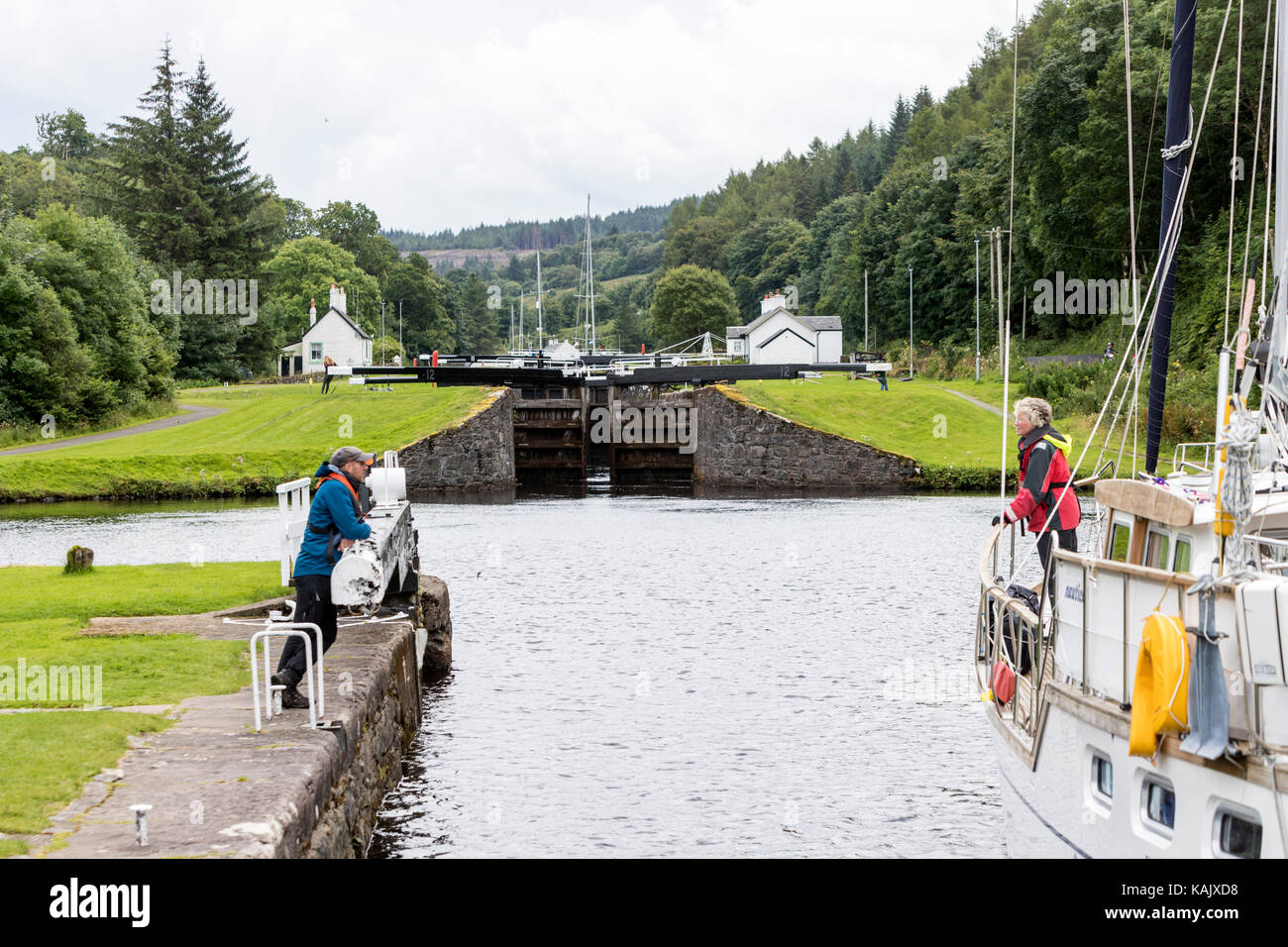 Opening the locks to allow a boat crossing a lock in Dunardry locks, Crinan Canal, Argyll and Bute Scotland Stock Photo