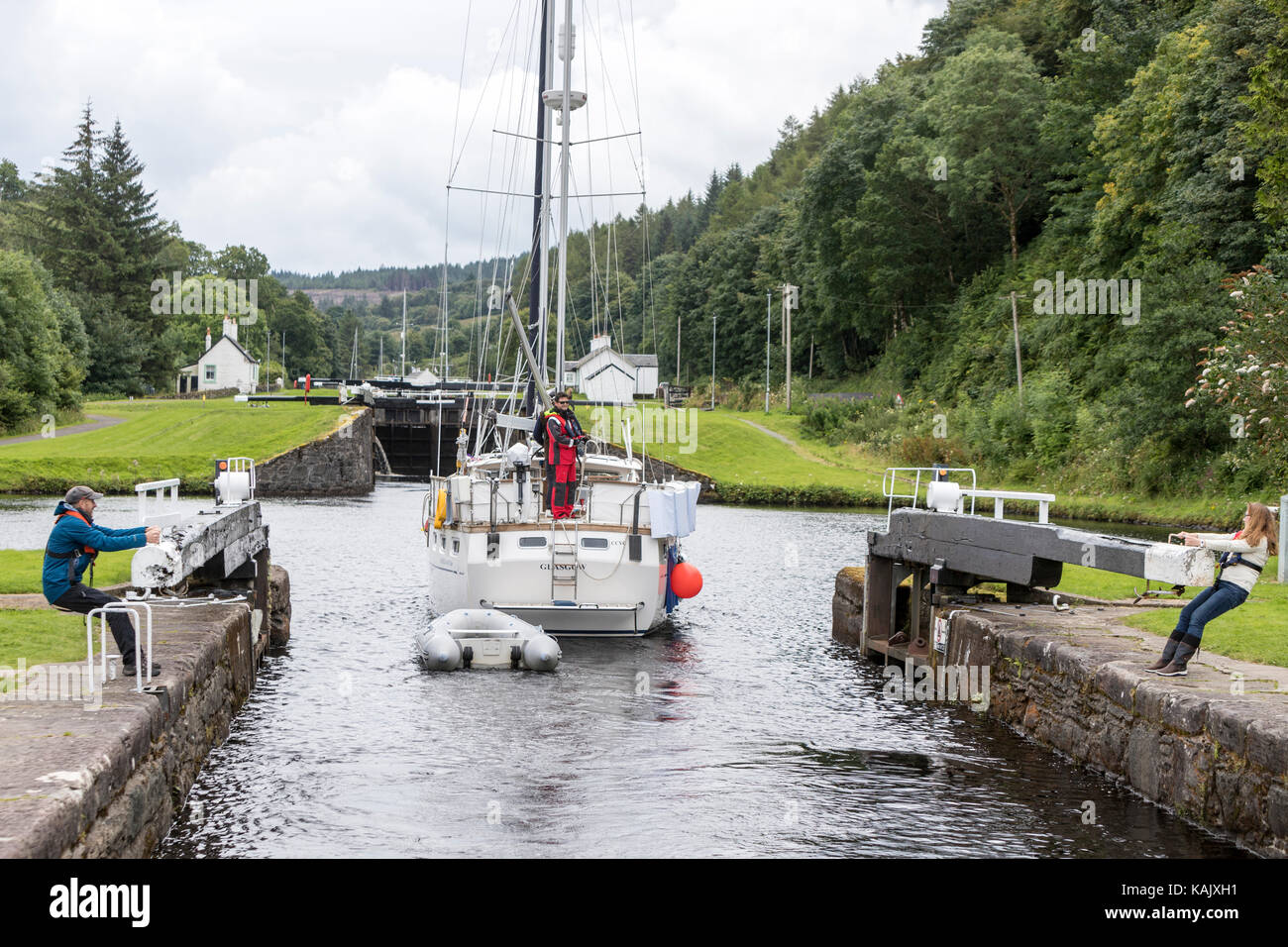 Opening the locks to allow a boat crossing a lock in Dunardry locks, Crinan Canal, Argyll and Bute Scotland Stock Photo