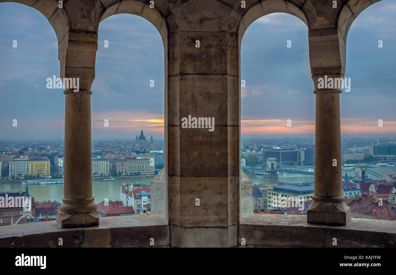 Budapest, Hungary - View from the Fisherman Bastion at sunrise with Szechenyi Chain Bridge and St.Stephen's Basilica on a cloudy morning Stock Photo