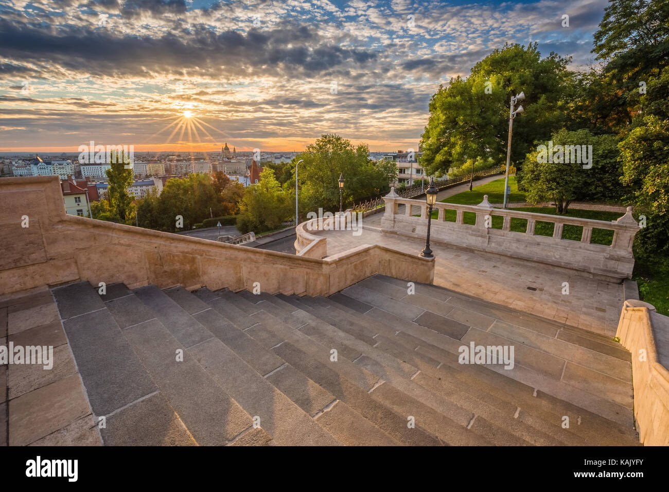 Budapest, Hungary - Staircase of the famous Fisherman Bastion on a beautiful sunny morning with sunrays and nice cloudy sky Stock Photo