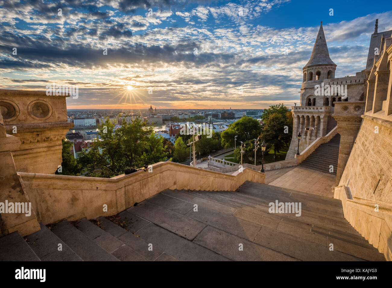 Budapest, Hungary - Staircase of the famous Fisherman Bastion on a beautiful sunny morning with sunrays and nice cloudy sky Stock Photo