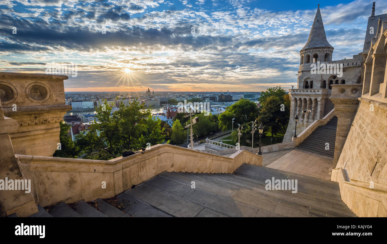 Budapest, Hungary - Staircase of the famous Fisherman Bastion on a beautiful sunny morning with sunrays and nice cloudy sky Stock Photo