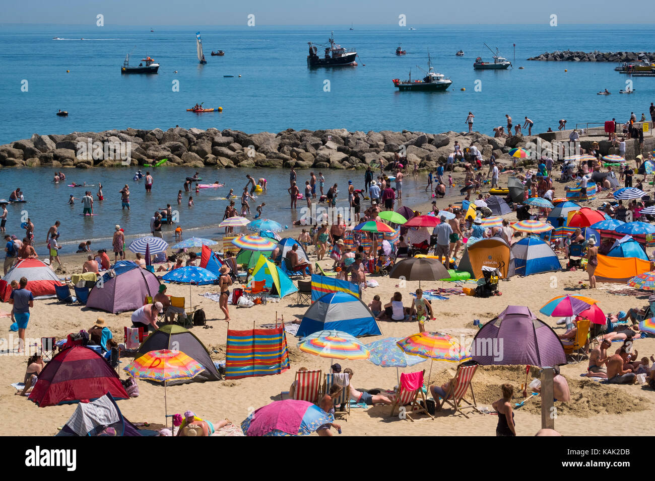 Crowded beach at in summer at Lyme Regis, Dorset, UK Stock Photo - Alamy