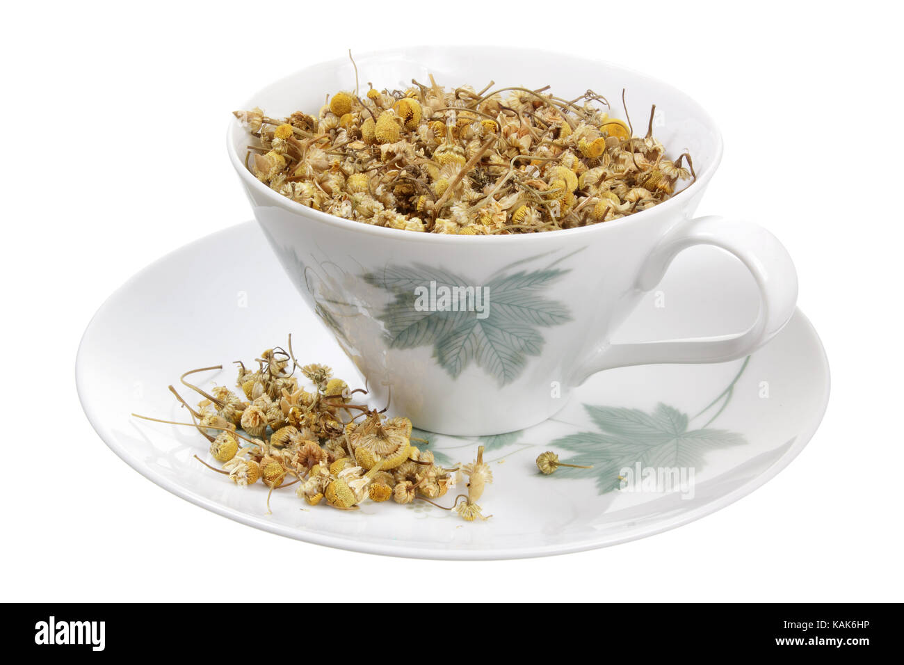 Dried Chamomile Tea in Cup on White Background Stock Photo - Alamy