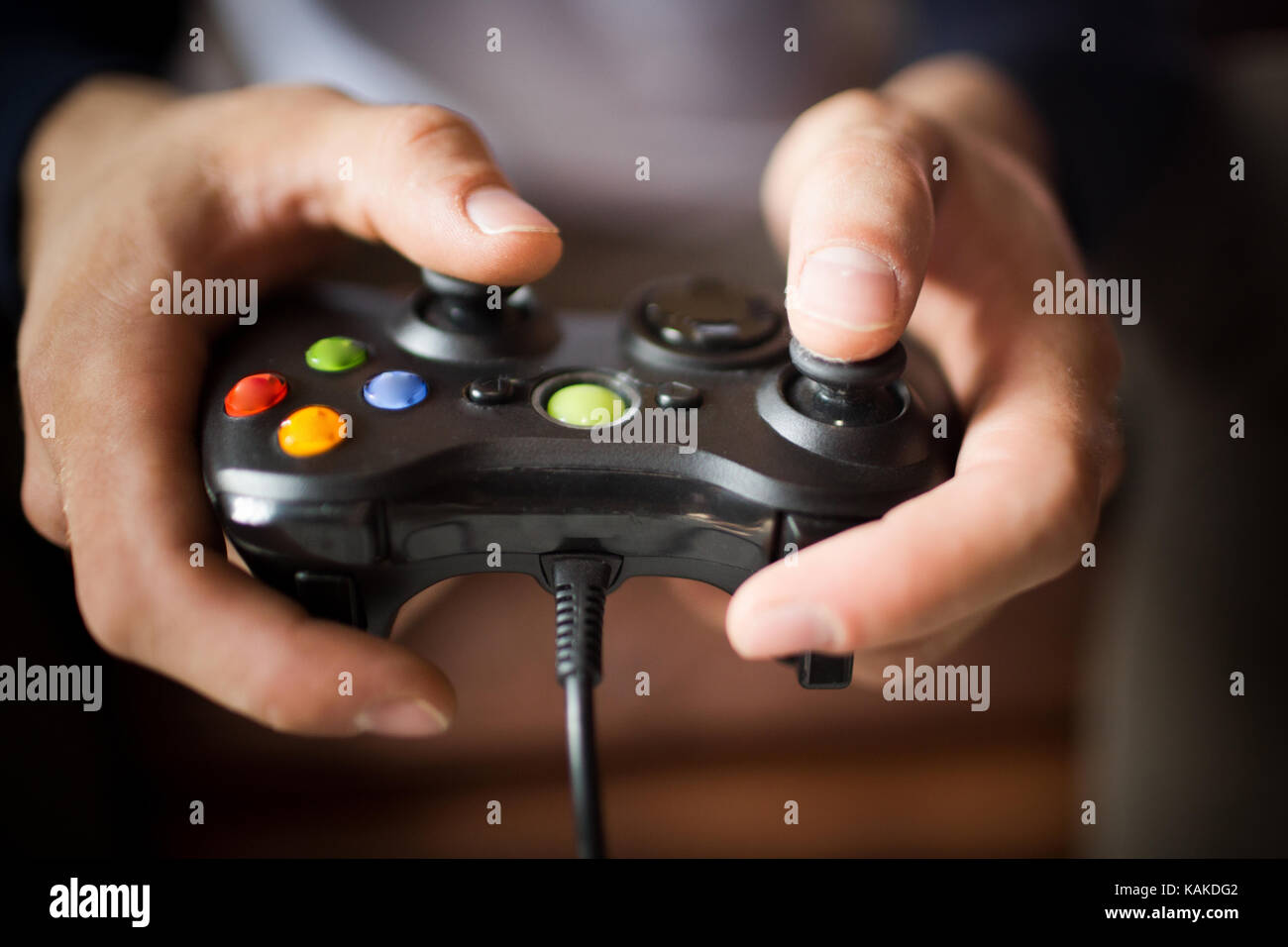 Close up view of joystick in mans hands. Stock Photo