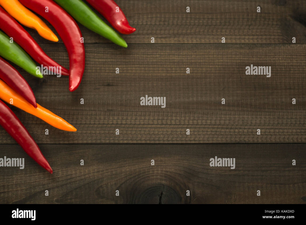 cayenne chilli peppers on wooden background Stock Photo - Alamy