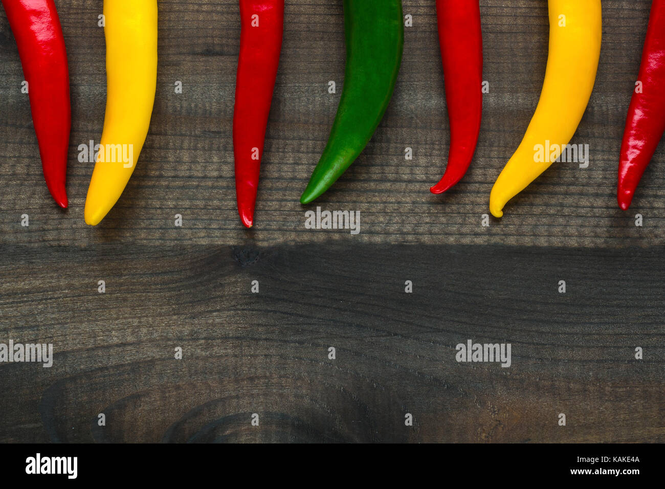 cayenne chilli peppers on wooden background Stock Photo - Alamy