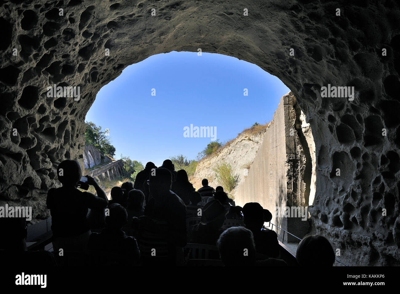 entry of a cruise ship into a tunnel du canal du midi near Beziers Stock Photo