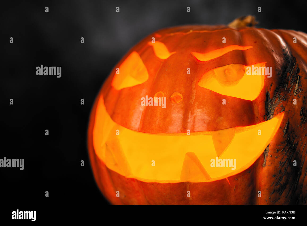 Three halloween Jack O' Lantern pumpkins on dark night background Stock ...