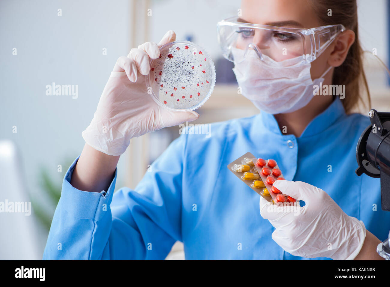 Female scientist researcher conducting an experiment in a laboratory ...