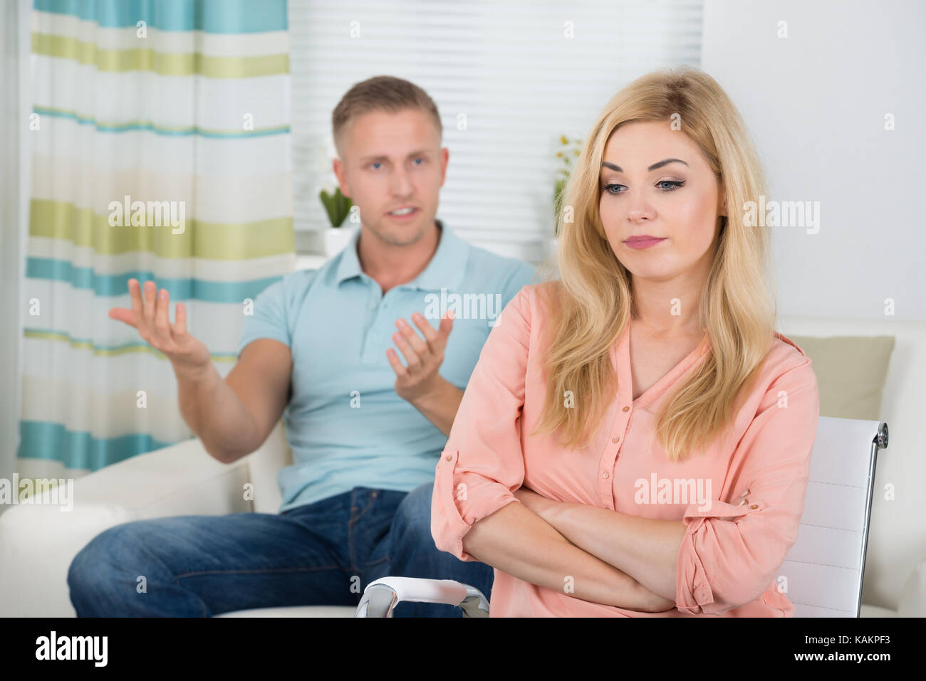Photo of young couple having argument at home Stock Photo