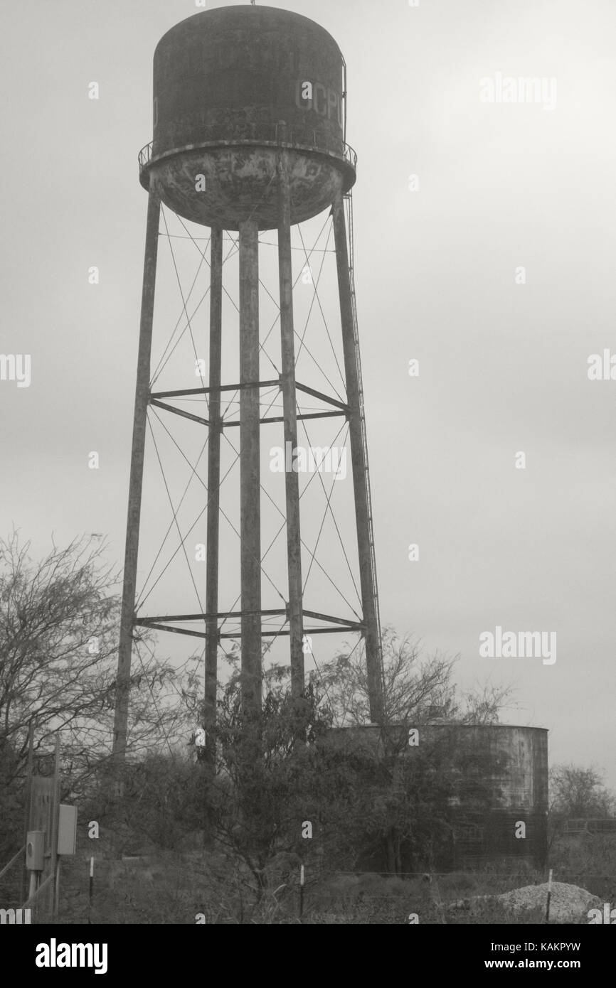 An old fashioned metal water tower in black and white Stock Photo - Alamy