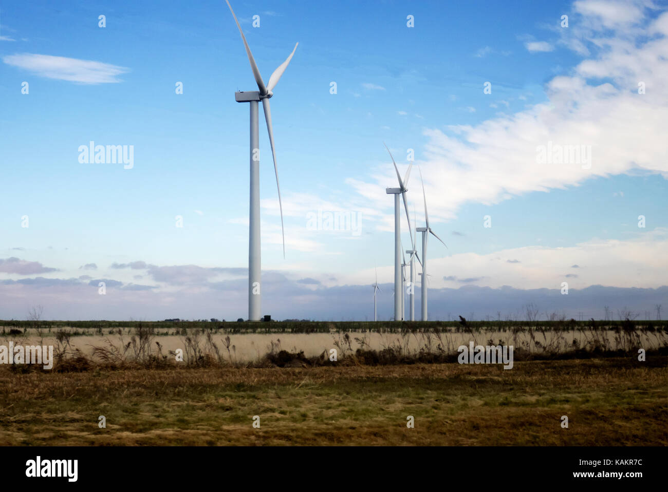 A windmill farm on a bright blue sky Stock Photo - Alamy