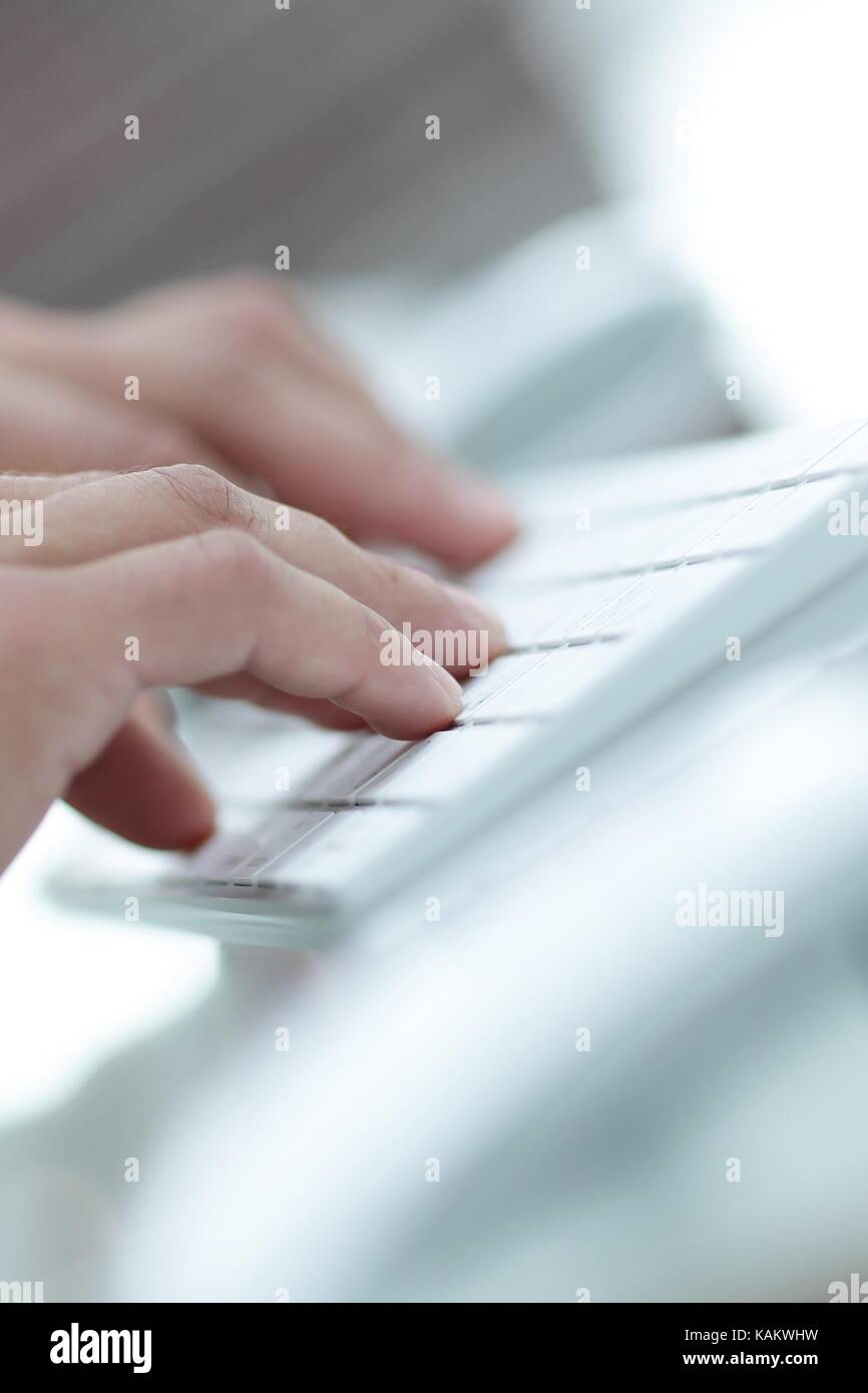 close-up of hand typing text on computer keyboard. Business background ...