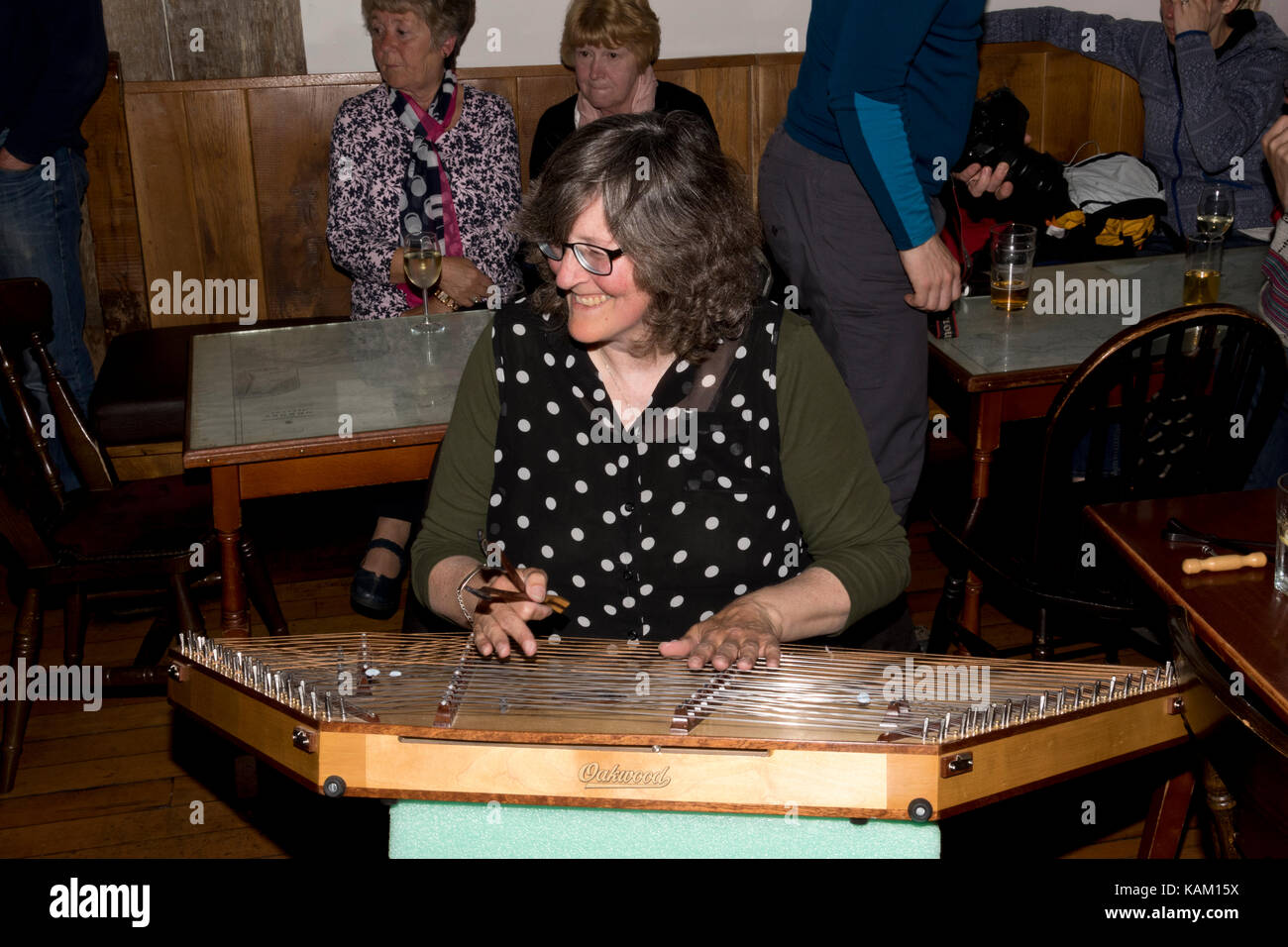 Woman playing a Hammer Dulcimer Stock Photo