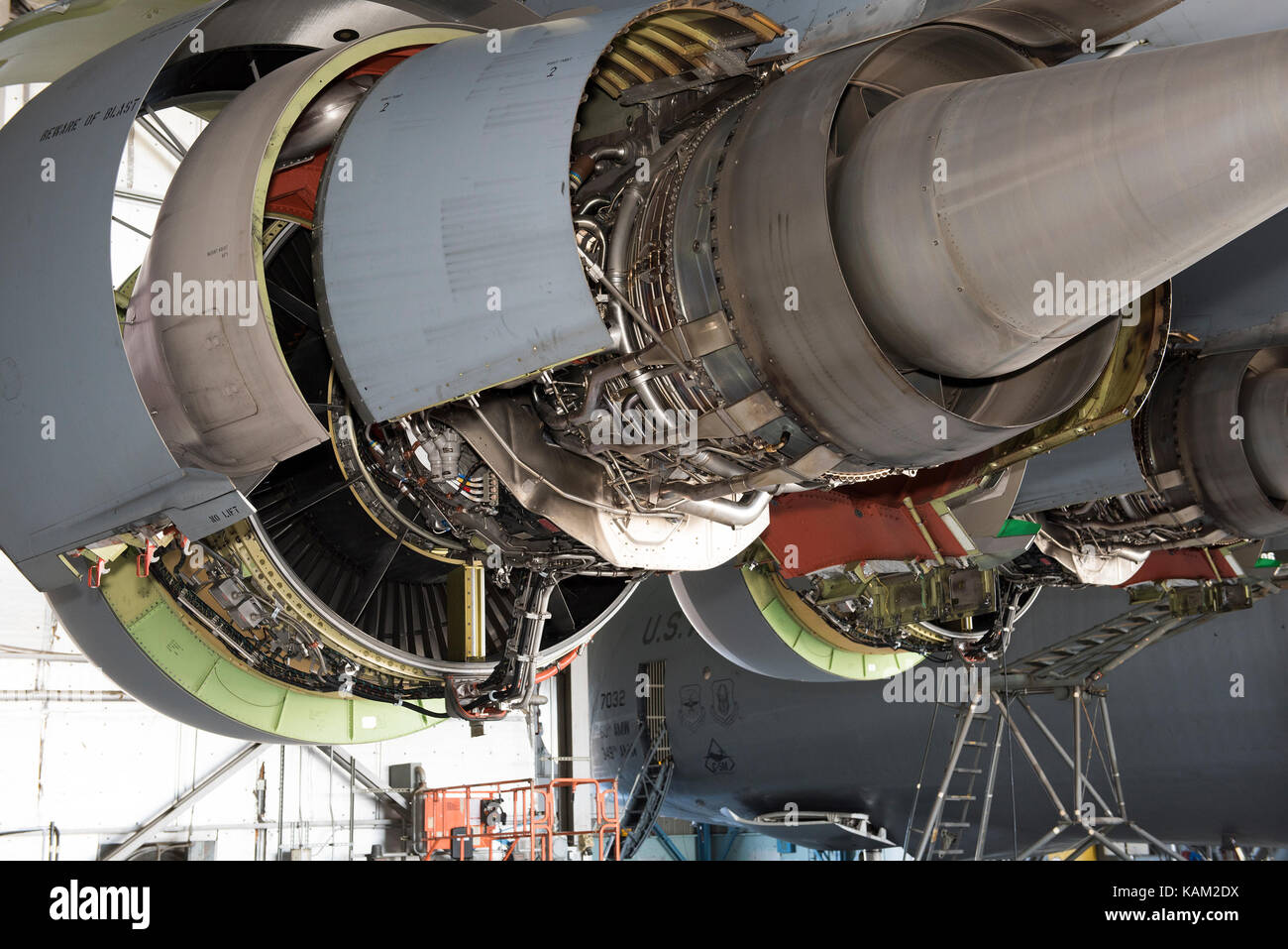 Engines covers are open to service a C5M Super Galaxy parked inside a
