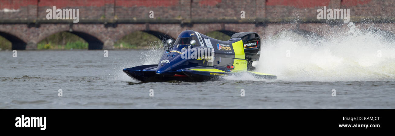 Powerboat racers racing at Carr Mill Dam in St Helens, England, UK Stock Photo
