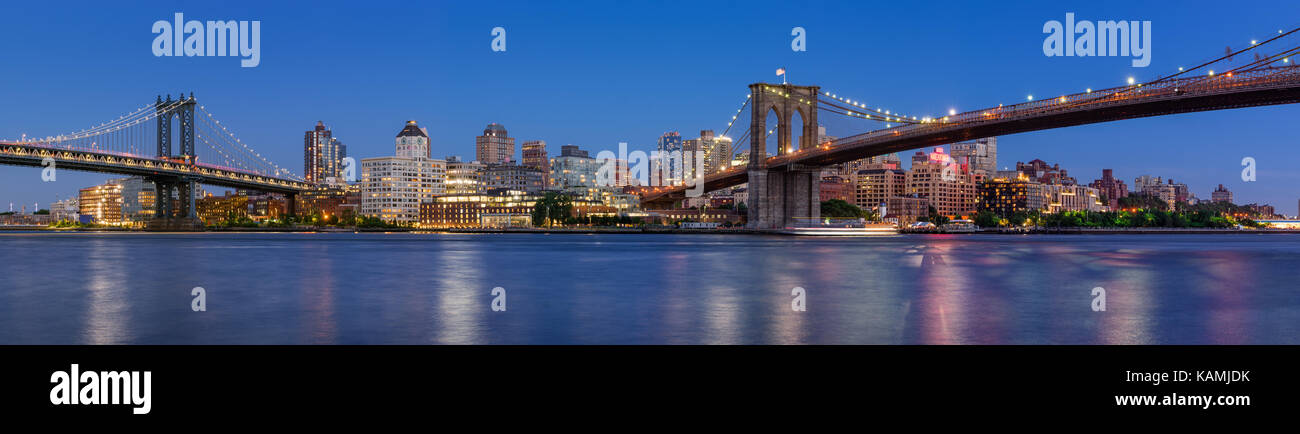 Evening panoramic view of Brooklyn Riverfront between the Manhattan Bridge and Brooklyn Bridge. Dumbo, Brooklyn, New York City Stock Photo