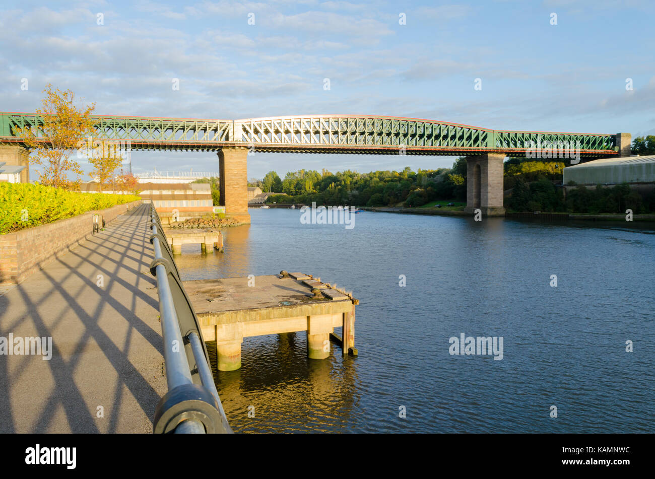 Walkway along the North side of the River Wear, showing Old Timber Jetties and the Queen Alexandra Bridge (1909) Stock Photo