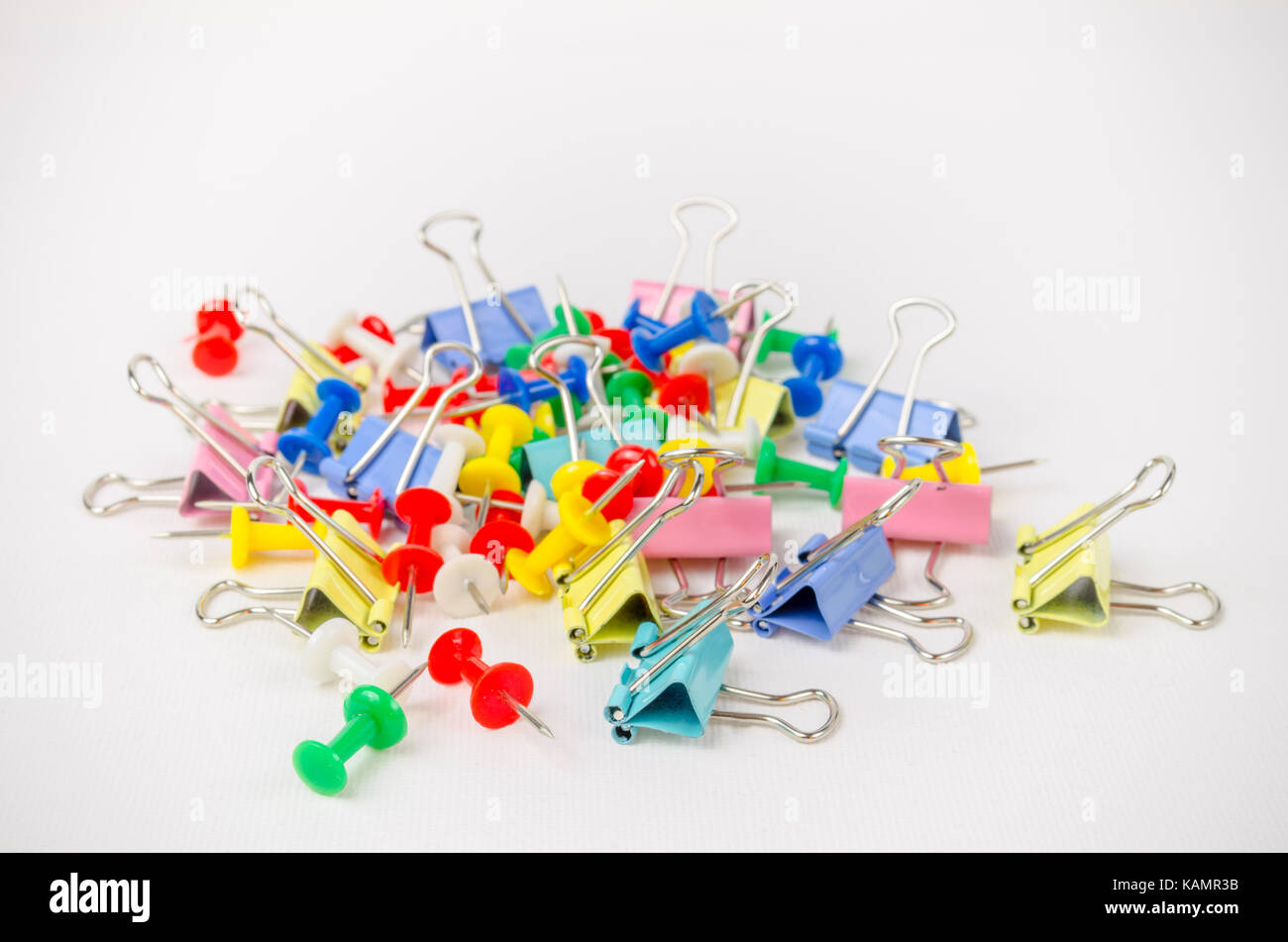 A Studio Photograph of a Group of Bulldog Clips and Drawing Pins Stock Photo