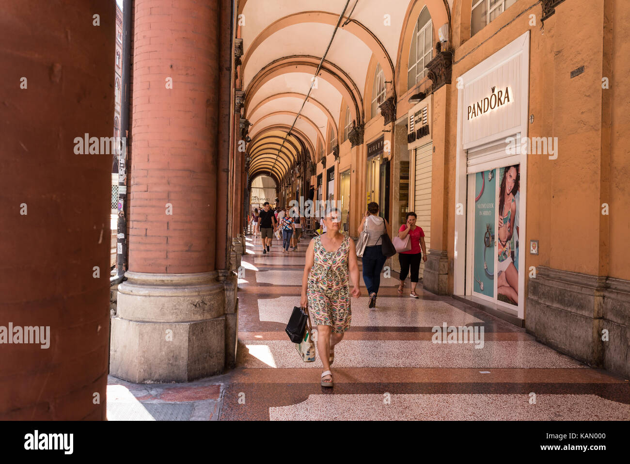 people-walking-in-bologna-porticoes-covered-footpath-in-via
