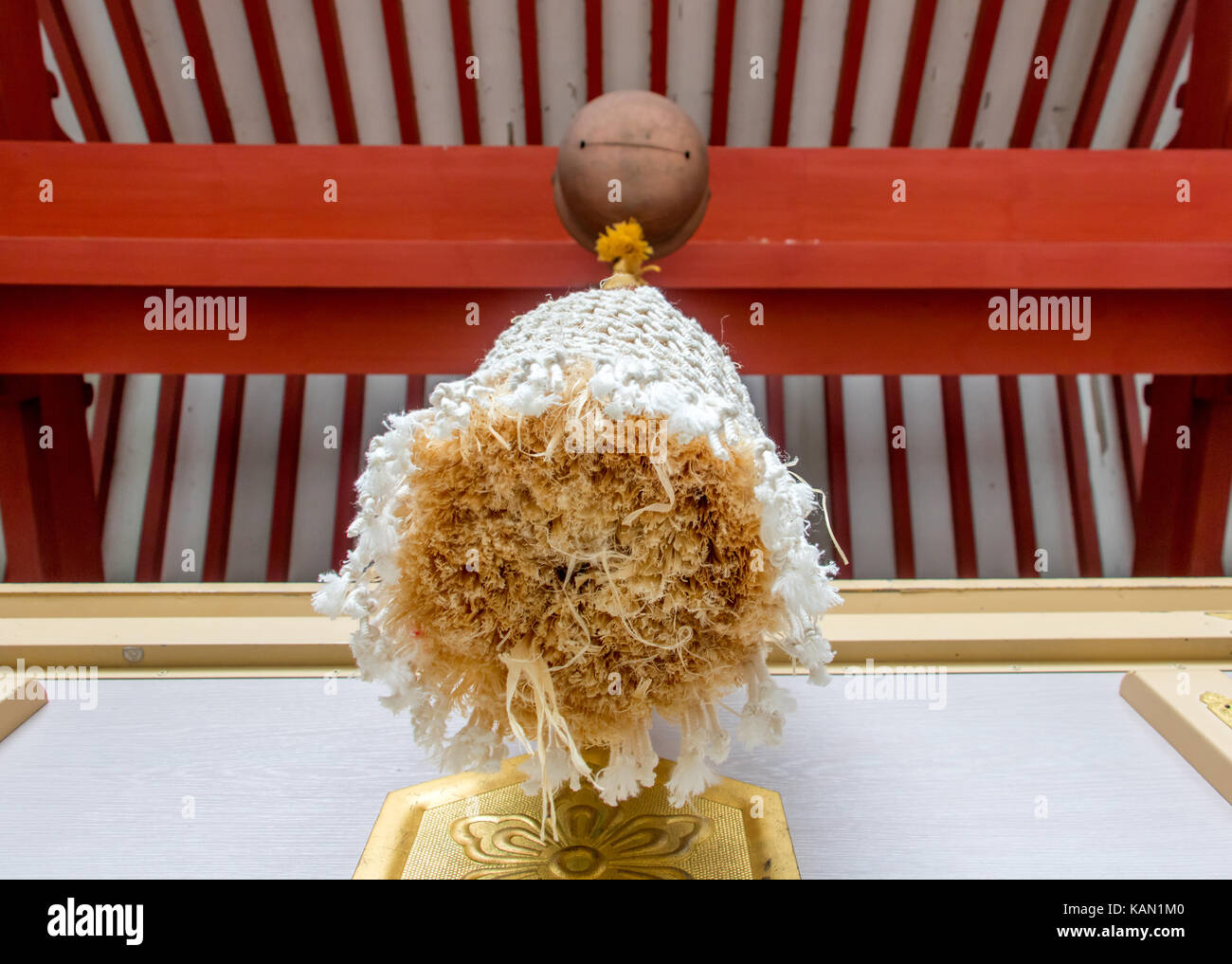 A decorative rope hangs from a bell in a shintoism temple, Japan. Main Sanctuary, Fuji omuro sengen-jinja shrine (Fujiomurosengen Shrine). Stock Photo