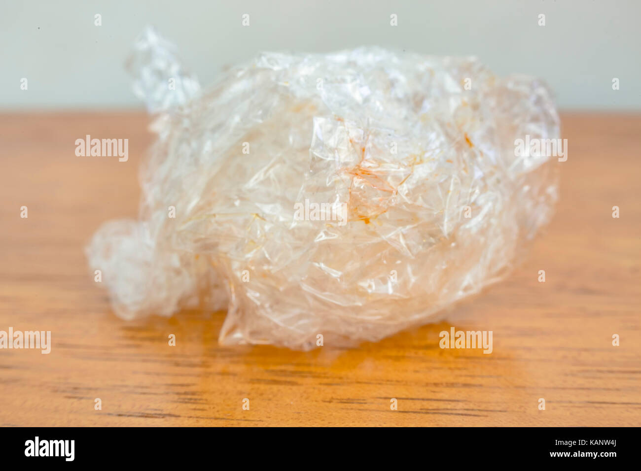 Plastic food wrap crumpled up isolated on background. Plastic Bubble Cushioning Wrap Stock Photo